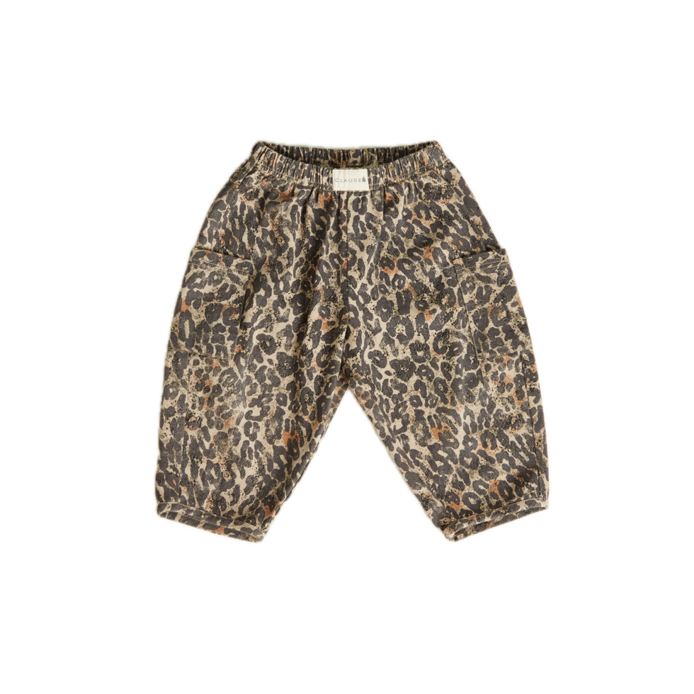 Chic and comfortable kids' pants with a bold leopard print, elastic waistband, cargo pocket details, and relaxed fit.